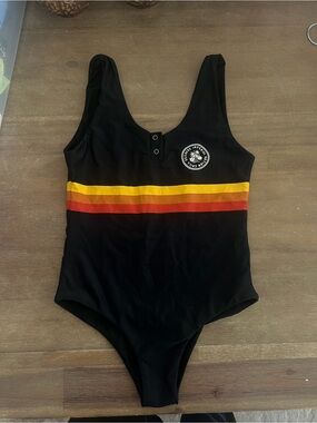 Imperial Motion Black One-Piece Swimsuit with Sunset Stripes